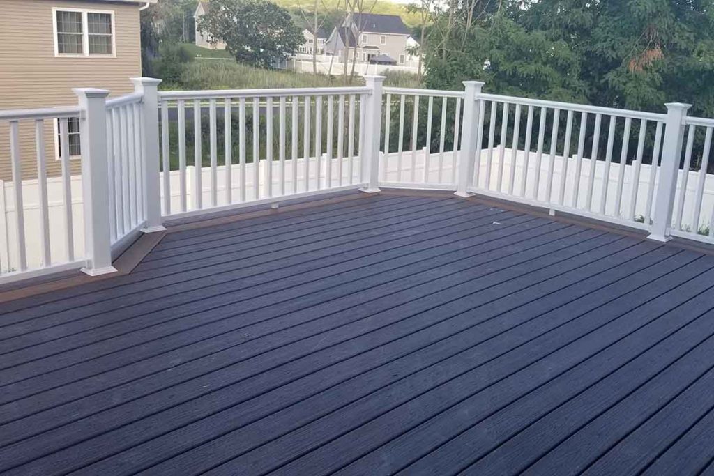 Brown decking in back of contemporary home